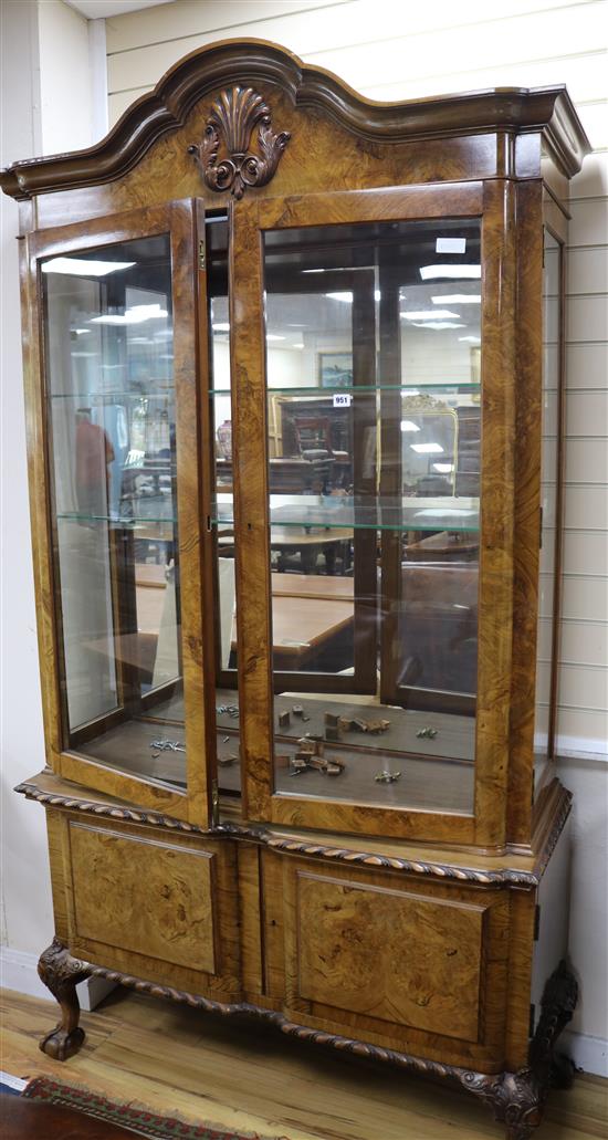 A George II style figured walnut cabinet on stand W.125cm